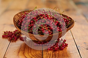 Red freshly berries currants in a basket on the table