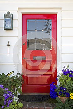 Red front door of an upscale home