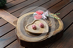 Red fruit brigadiers on a wooden chopping board. photo