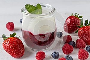 Red fruit compote with mint leaves and fruit