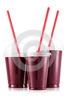 Red fruit smoothie in three size of pet cup