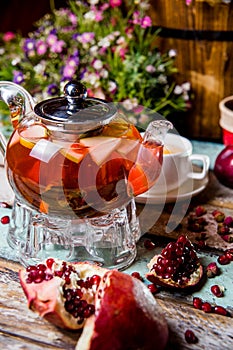 red fruit tea in a transparent teapot