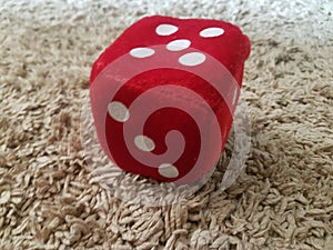 Red furry dice for children playing