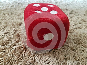 Red furry dice for children playing