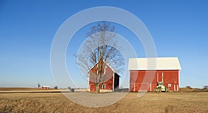 Red gable roof agriculture barns under blue sky FingerLakes NYS