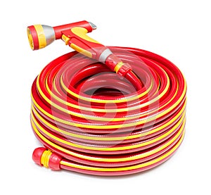 Red garden coiled hose with handle isolated