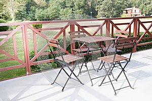 Red garden set of chairs and table, metal