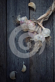 Red garlic on rustic wood table