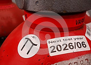 Red gas cylinders in warehouse storage