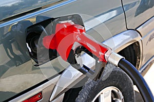 Red gasoline pump nozzle