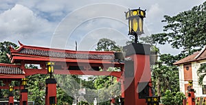 Red gateway from Chinese temple with yellow lampion photo taken in Bogor Indonesia