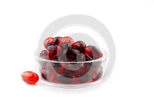 Red gel medical capsules, isolated on white background