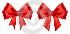 Red gift bow isolated on white background. Ribbon bow of shiny satin closeup. Holiday Christmas decoration as design