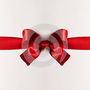 Red gift bow on white