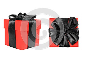 Red gift box with black bow on a white background