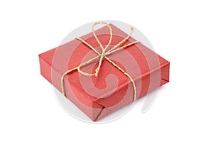 Red gift box with bow isolated on white. Wrapped Christmas or birthday gift box. Single holiday present
