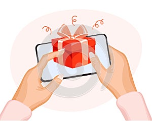 Red gift box with a bow in a mobile phone in hands. The concept of virtual congratulations. Festive background