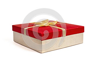 Red gift box with gold ribbon bow, isolated on white