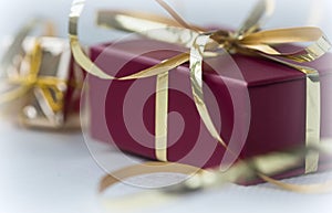 Red gift box with golden ribbo