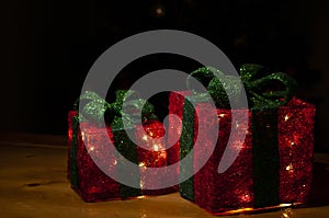 red gift box with lights and dark background