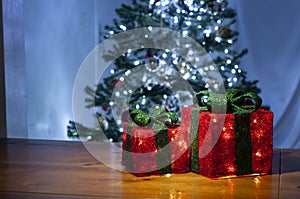 Red gift box with lights and dark background