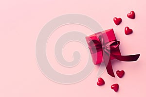 Red gift box on pink background