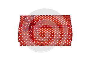 Red gift box with ribbon isolated on a white