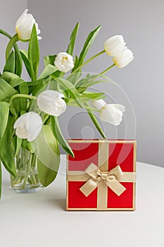 Red Gift Box and White Tulips on White Table