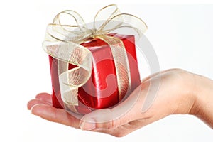 Red gift box in woman's hand