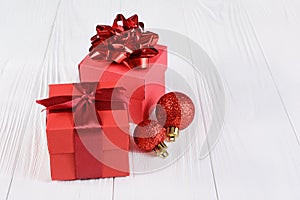 Red gift boxes with bows and Christmas tree balls