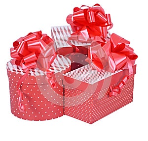 Red gift boxes with ribbon bow isolated on white