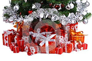 Red gift boxes under Christmas tree