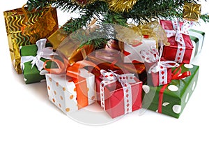Red gift boxes under Christmas tree
