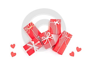 Red gift boxs with bow and Red papercut heart shapes on white background