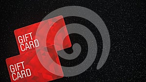 Red gift cards on black background like starry sky.