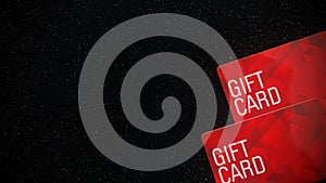 Red gift cards on right side of black background .