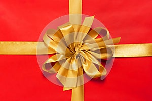 Red gift with golden bow