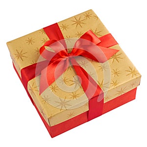 Red gift or present box with golden colored top and red ribbon bow isolated on white background