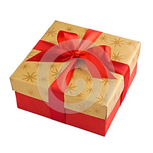 Red gift or present box with golden colored top and red ribbon bow isolated on white background