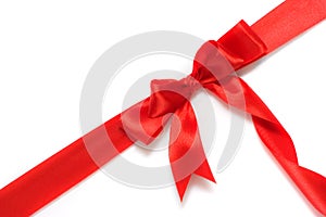 Red gift ribbon and bow isolated over white