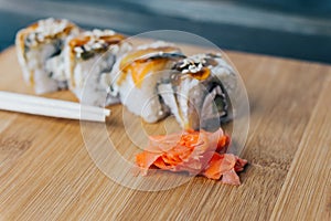 red ginger sushi chopsticks wooden board meal delicacy