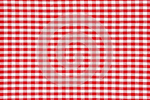Red gingham fabric pattern background.