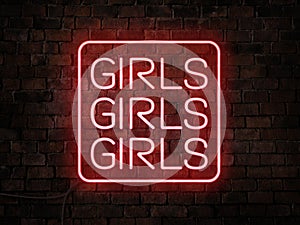 A red Girls Girls Girls neon sign. Signage for a nightclub, adult entertainment or gentleman\'s club