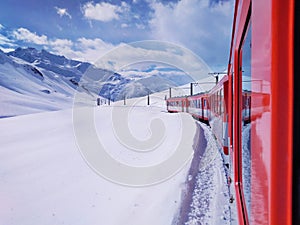 Red Glacier Express on white snow