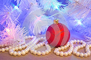 Red glass glitter Christmas bauble with natural pearl garland