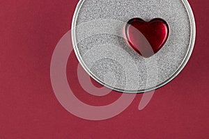 Red glass heart on box with Valentine gift