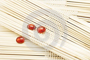 Red Glass Pebbles On Blurred Wooden Sets. Spa Wellness Concept