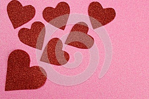 Red glitter hearts on pink background, Valentine's Day