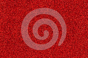 Red glitter textured paper closeup background