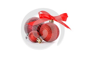 Red glittering Christmas baubles isolated